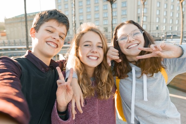 Portrait of three teen friends boy and two girls